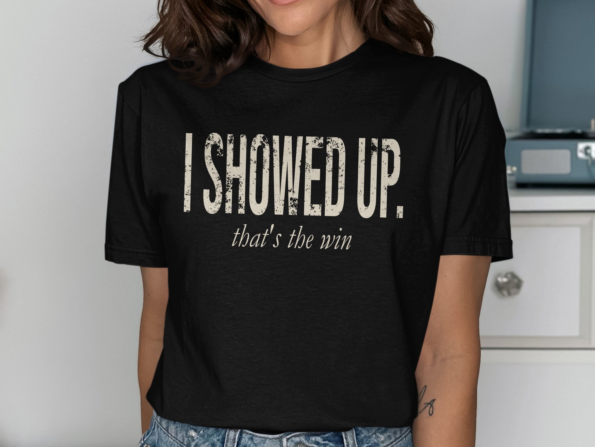Black t-shirt with distressed "I SHOWED UP." and "that's the win" text.