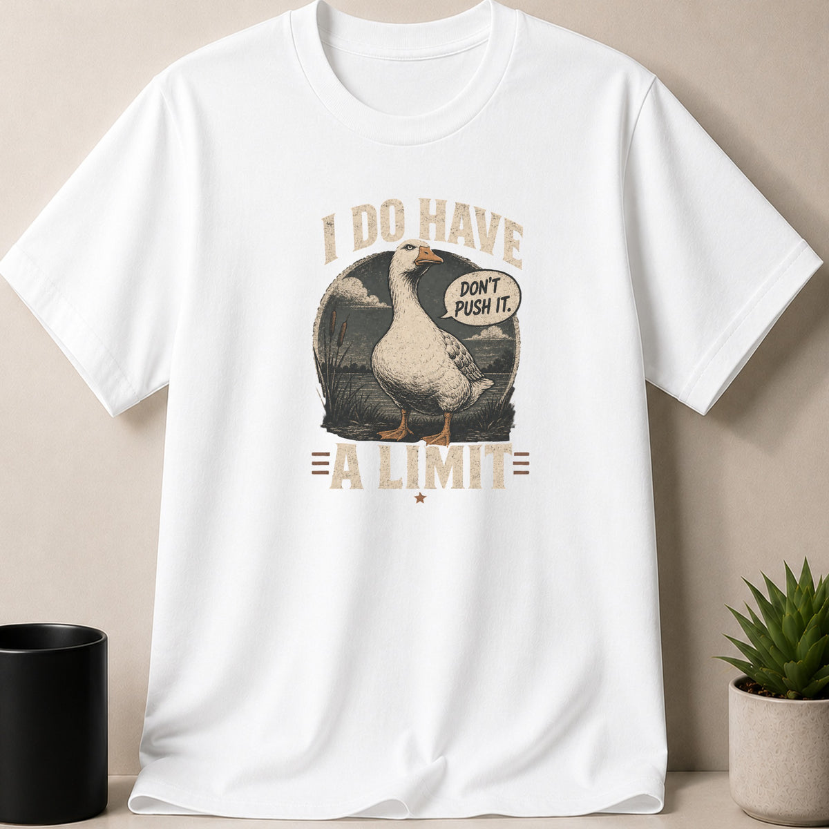 White t-shirt with a vintage graphic of a goose saying "Don't push it."