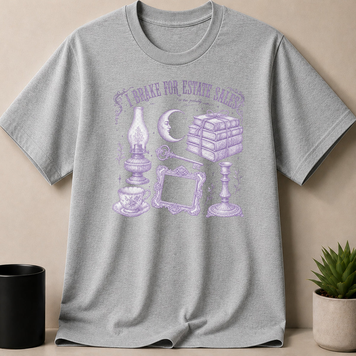 Grey t-shirt with purple "I brake for estate sales" text and antique illustrations.