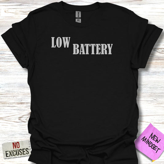 Black t-shirt with white text "LOW BATTERY" and a sticky note "NEW MINDSET".