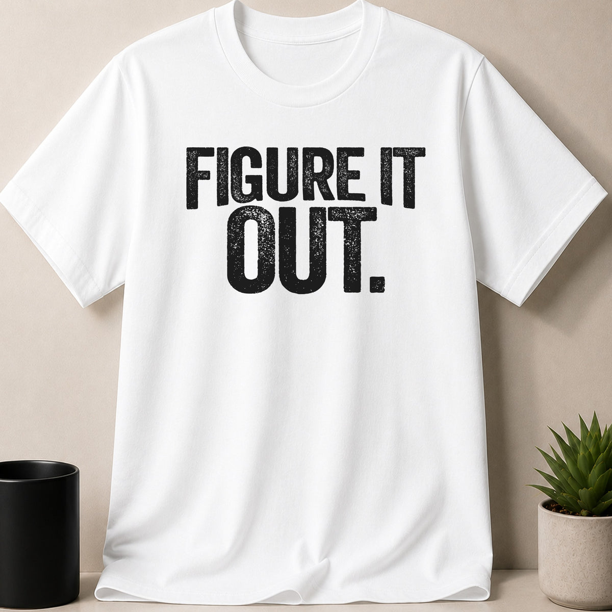 White t-shirt with black distressed text "FIGURE IT OUT."