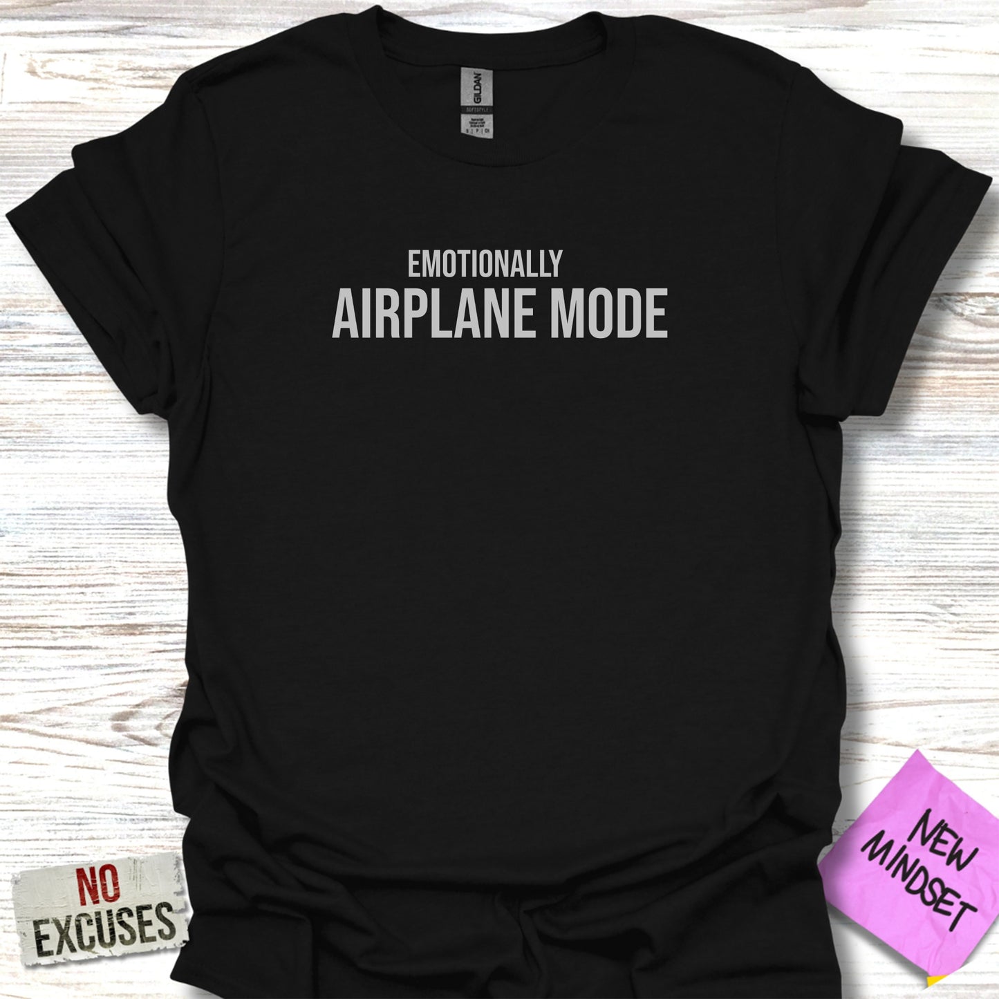 Black t-shirt with "EMOTIONALLY AIRPLANE MODE" in white text.