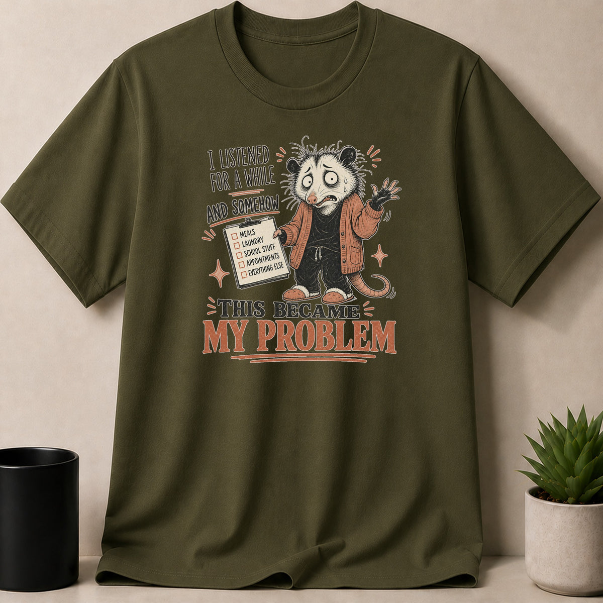 Military Green t-shirt — Opossum with checklist on shirt reads, "This became my problem."