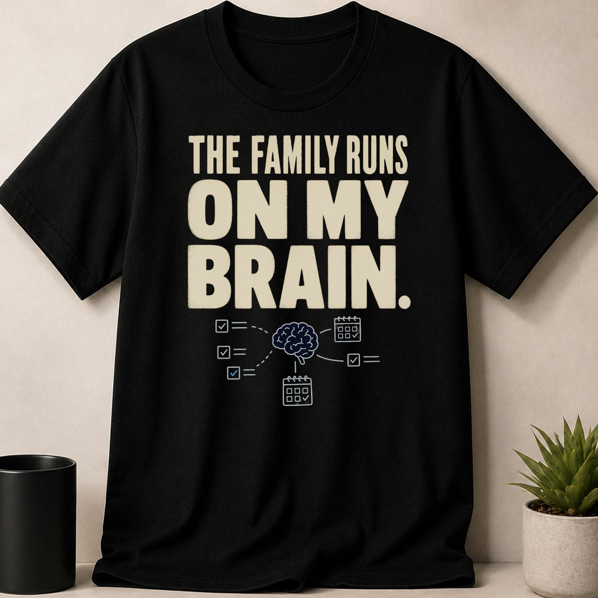 Black t-shirt with text "THE FAMILY RUNS ON MY BRAIN." and brain graphic.