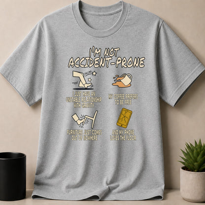 Gray t-shirt with I'm Not Accident-Prone cartoon illustrations and text.