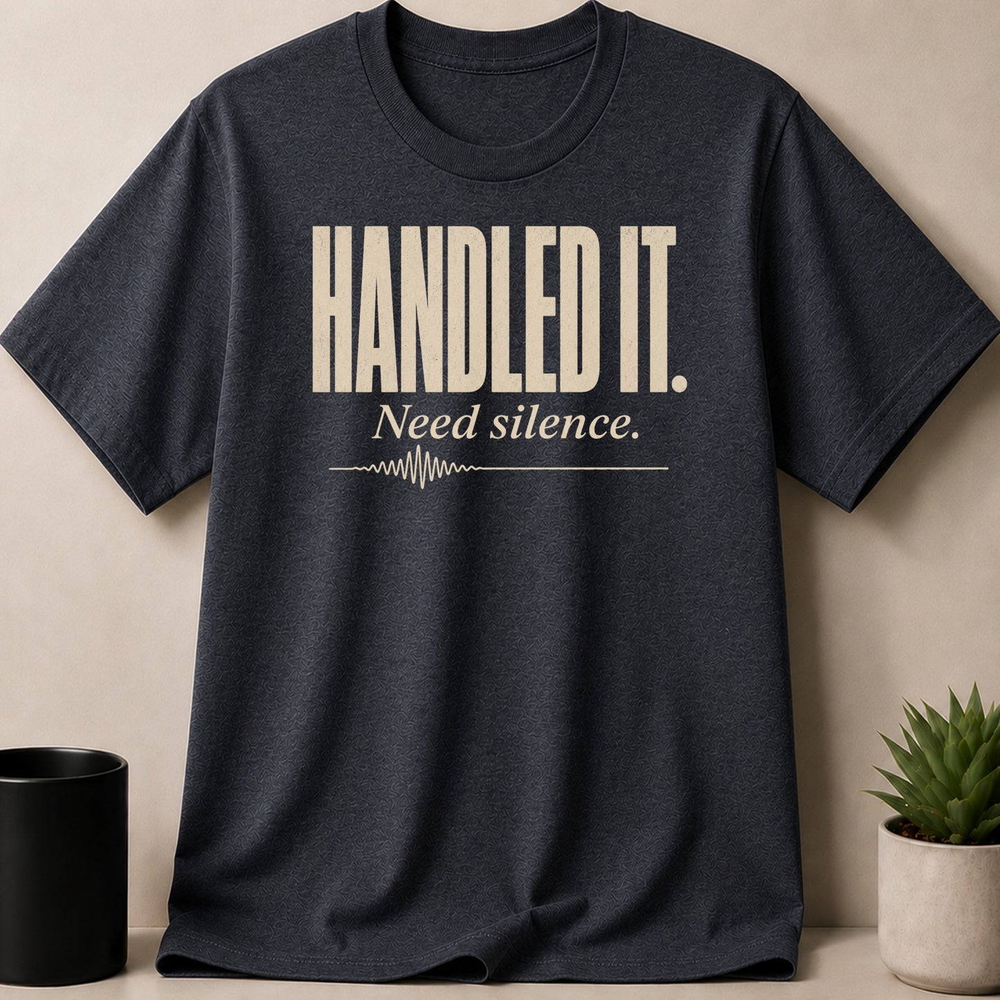 Dark grey t-shirt with "HANDLED IT. Need silence." text and a waveform graphic.