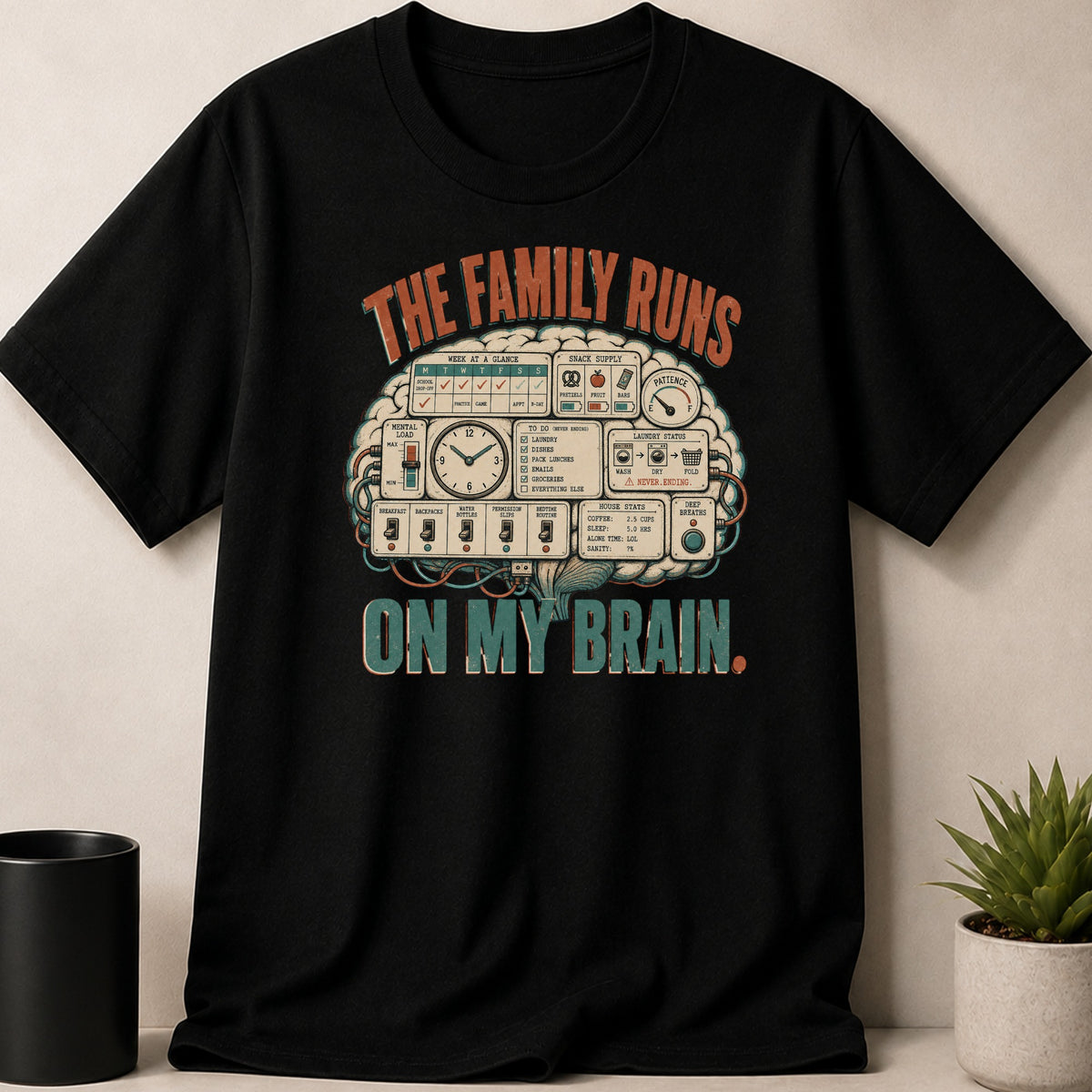 Black t-shirt with graphic featuring "The Family Runs On My Brain" and a brain-shaped control panel.