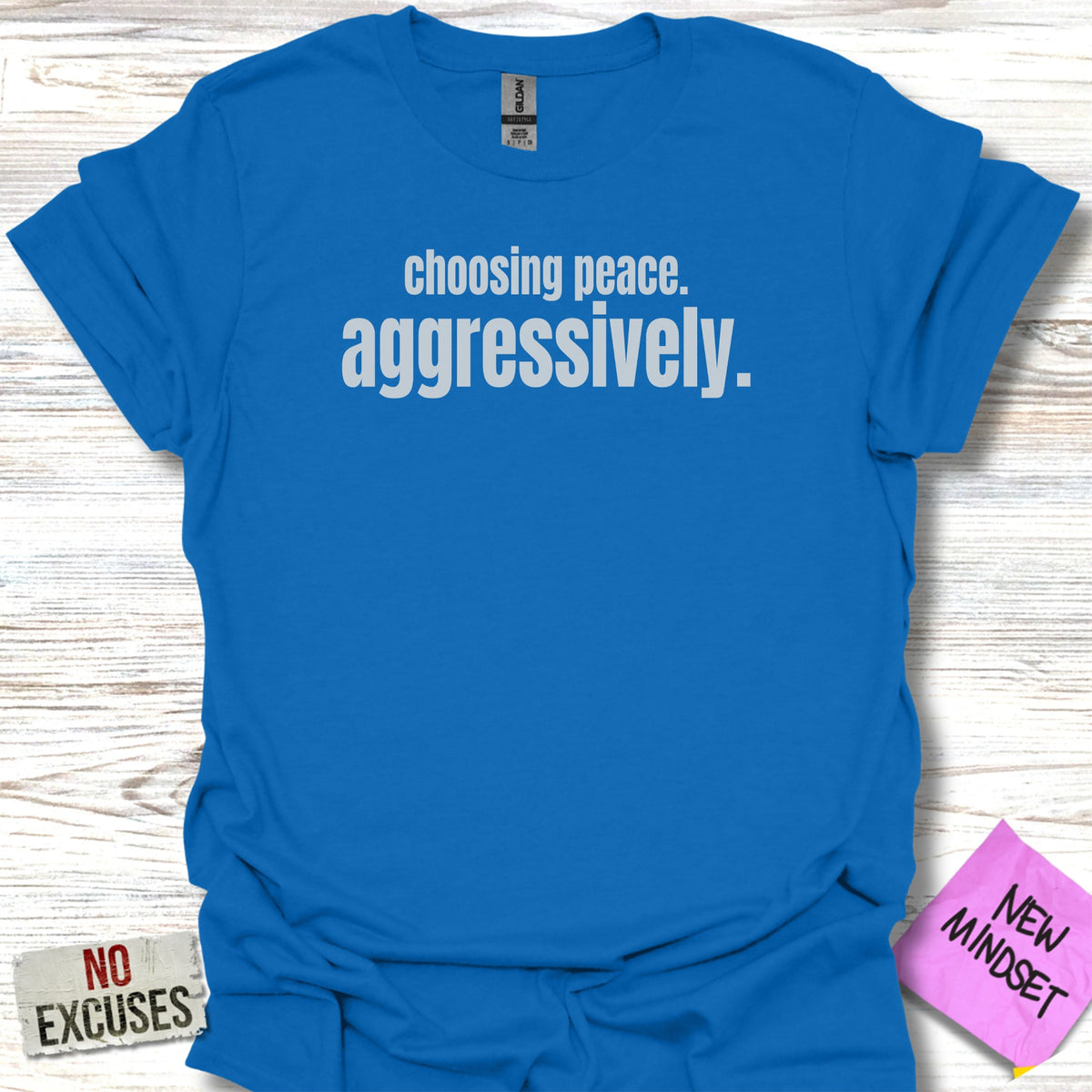 Royal blue t-shirt with "choosing peace. aggressively." text.
