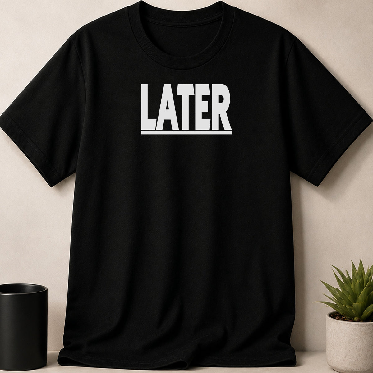 Black t-shirt with the white text "LATER" centered.