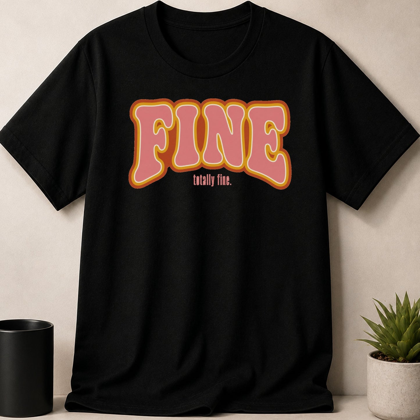 Black t-shirt with pink and orange "FINE totally fine." text.
