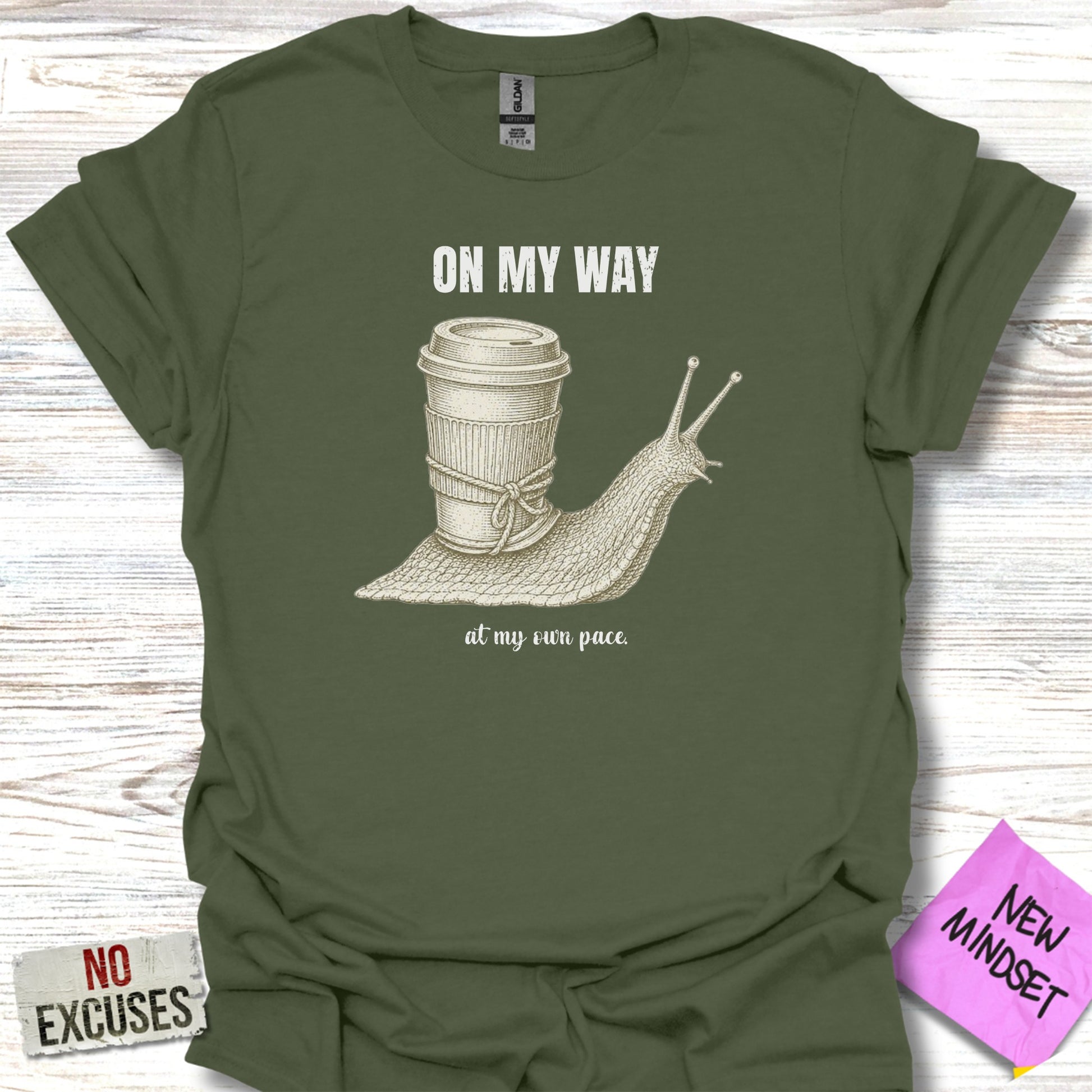 T-shirt with a snail carrying a coffee cup, text "ON MY WAY" and "at my own pace."