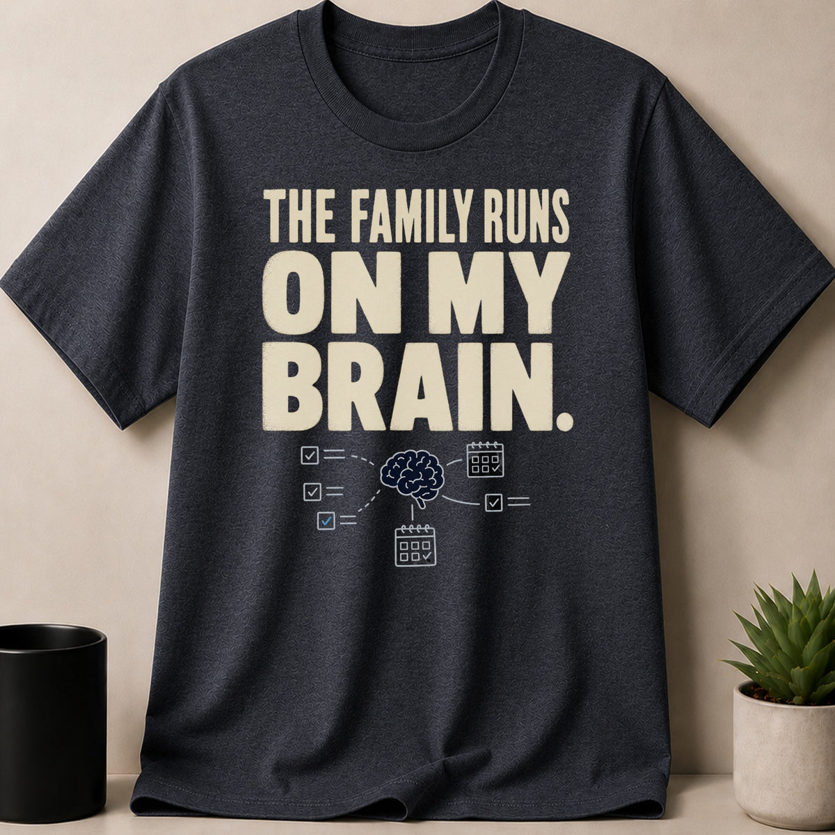Dark t-shirt with text "The family runs on my brain" and brain graphic.