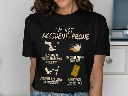 Black t-shirt with text "I'm Not Accident-Prone" and four humorous graphics.