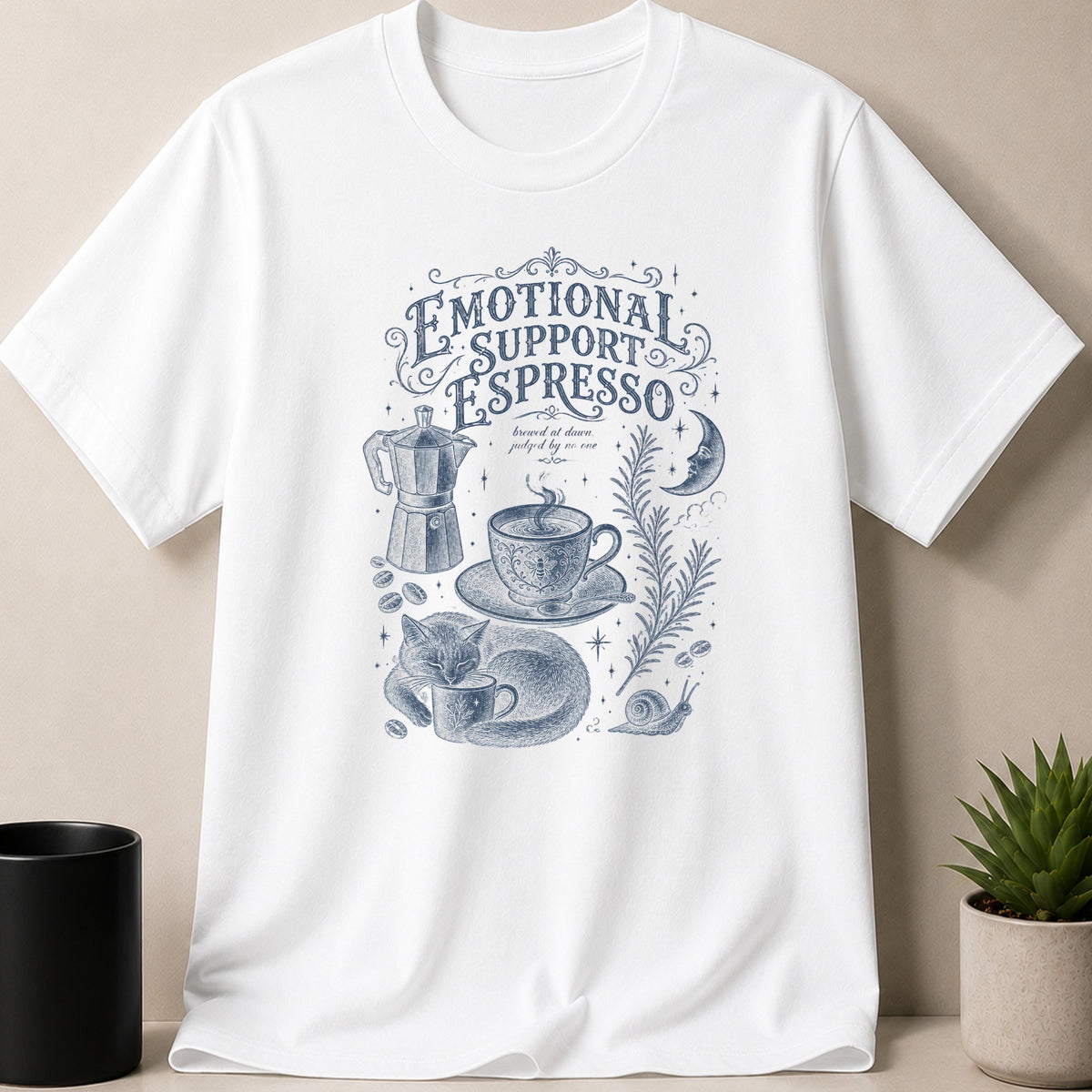 White t-shirt with blue sketch of cat, coffee, and text.