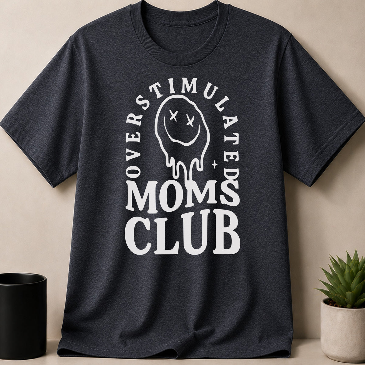 Dark Heather t-shirt — Overstimulated Moms Club graphic t-shirt with melting smiley face design.