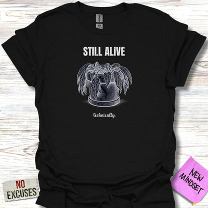 Black t-shirt with "STILL ALIVE technically." text and a potted plant illustration.