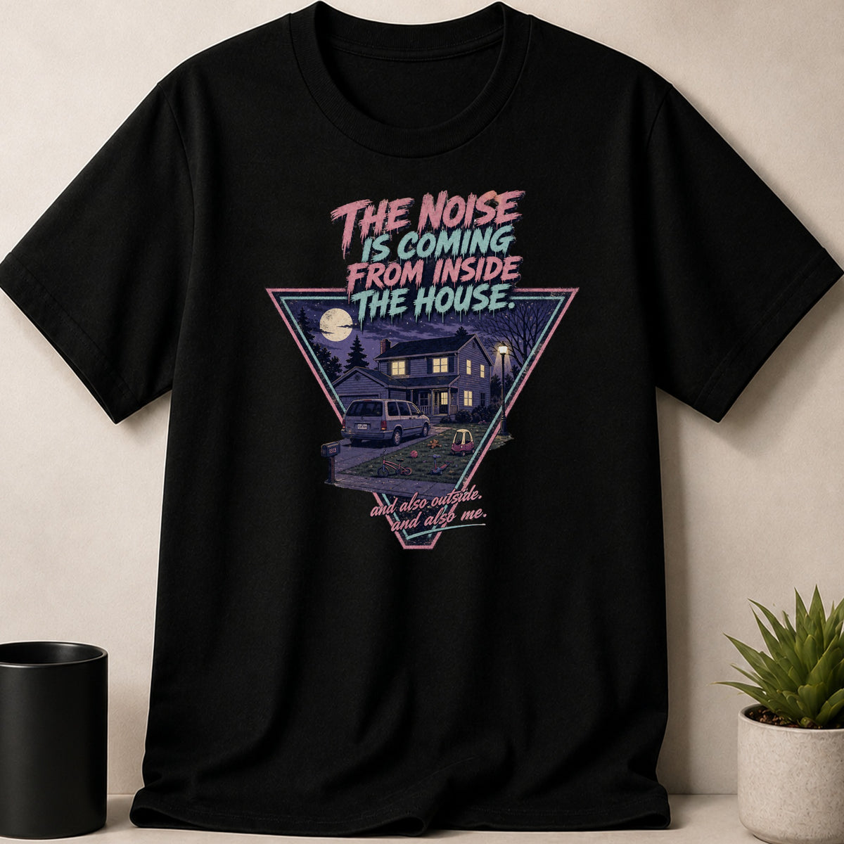 Black t-shirt with graphic: "The Noise is Coming From Inside The House" and suburban scene.