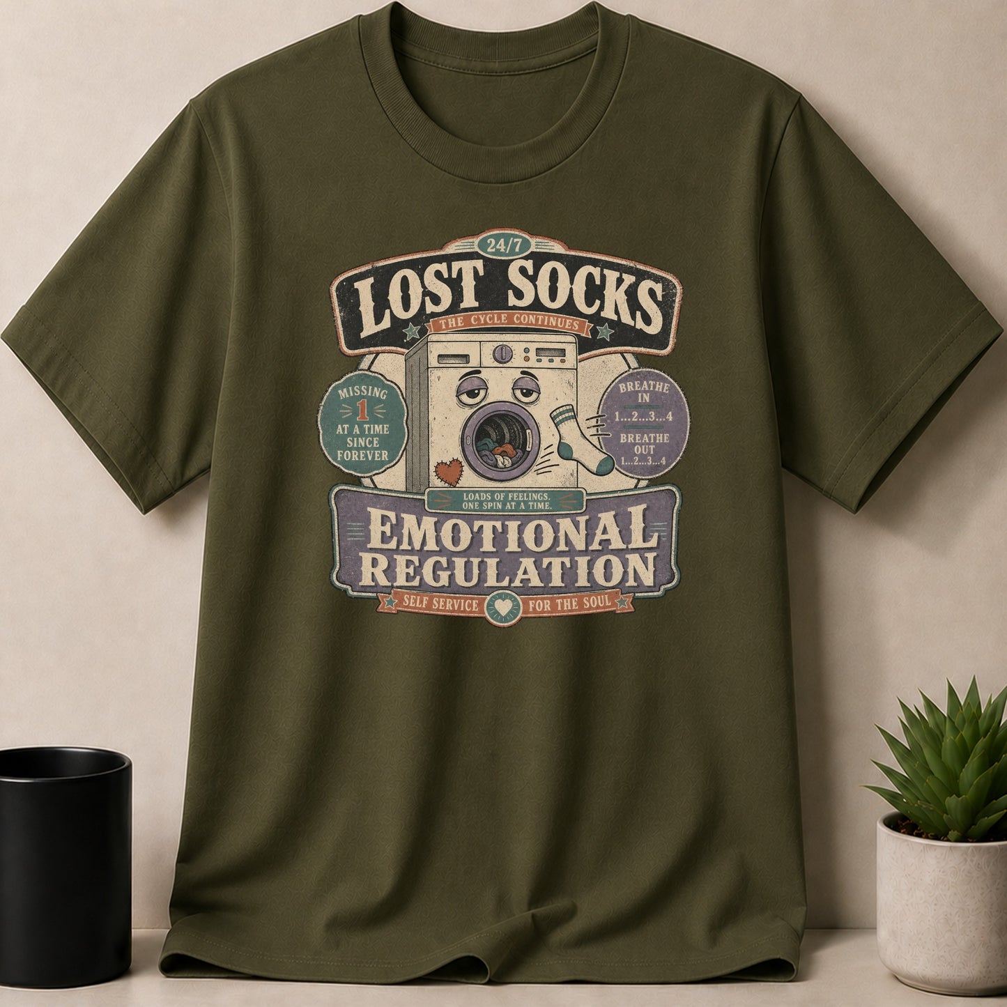 Green t-shirt with "Lost Socks Emotional Regulation" graphic featuring a washing machine.