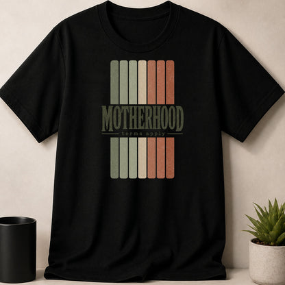 Black t-shirt with "Motherhood terms apply" text in vintage striped design.