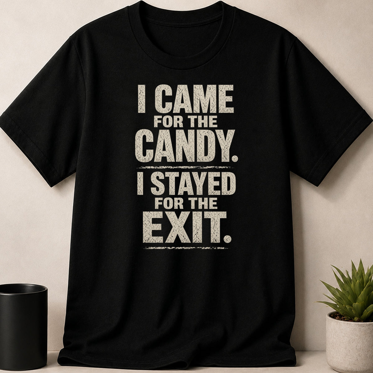 Black t-shirt with distressed text "I CAME FOR THE CANDY. I STAYED FOR THE EXIT."