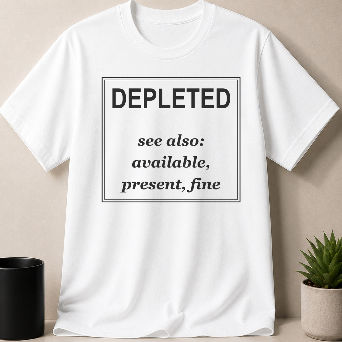 White t-shirt with black text "DEPLETED see also: available, present, fine".