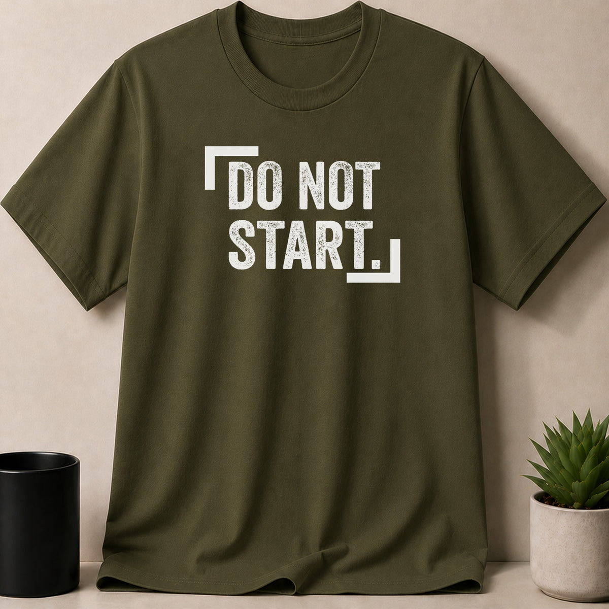 Olive green t-shirt with white distressed text reading "DO NOT START."