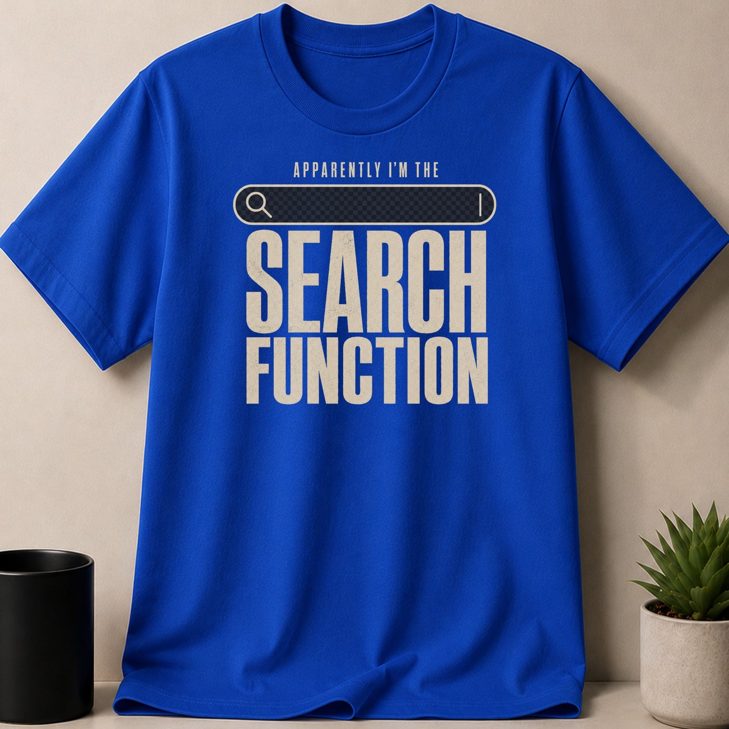 Blue t-shirt with "APPARENTLY I'M THE SEARCH FUNCTION" graphic.