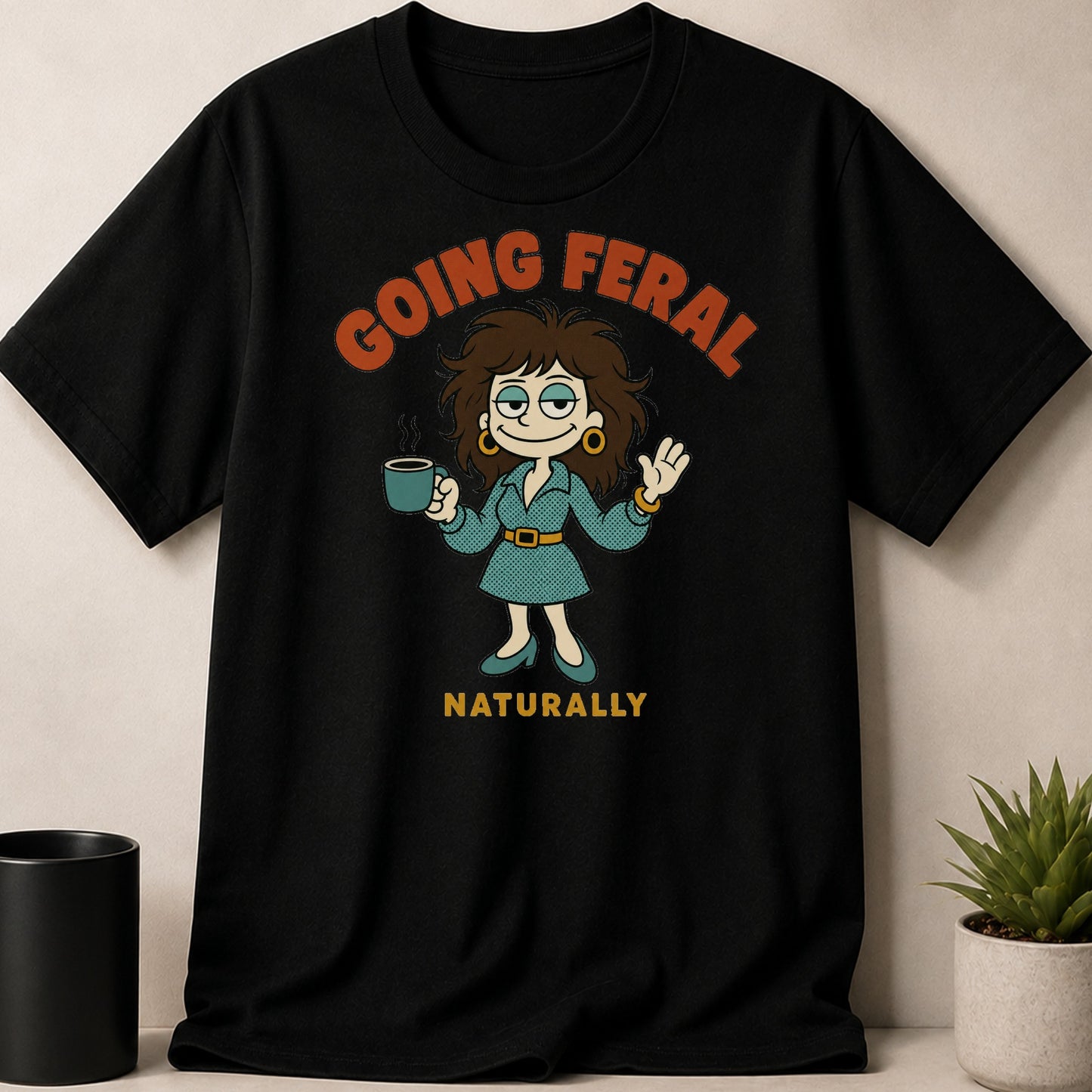 Black t-shirt with "GOING FERAL NATURALLY" text and cartoon woman holding coffee.