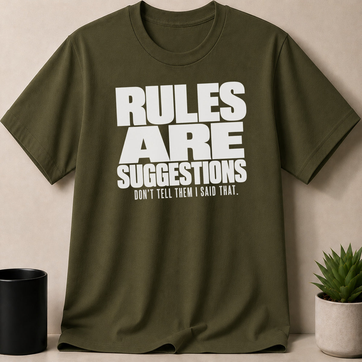 Olive t-shirt with white text "RULES ARE SUGGESTIONS DON'T TELL THEM I SAID THAT."