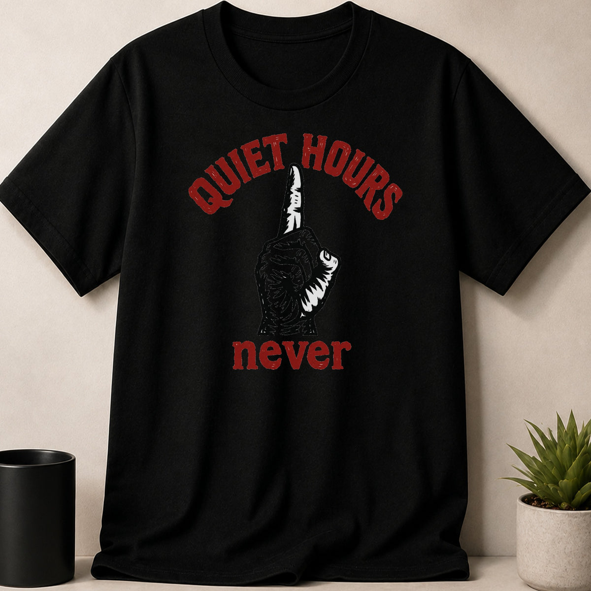 Black t-shirt with red text "QUIET HOURS never" and a finger to lips graphic.