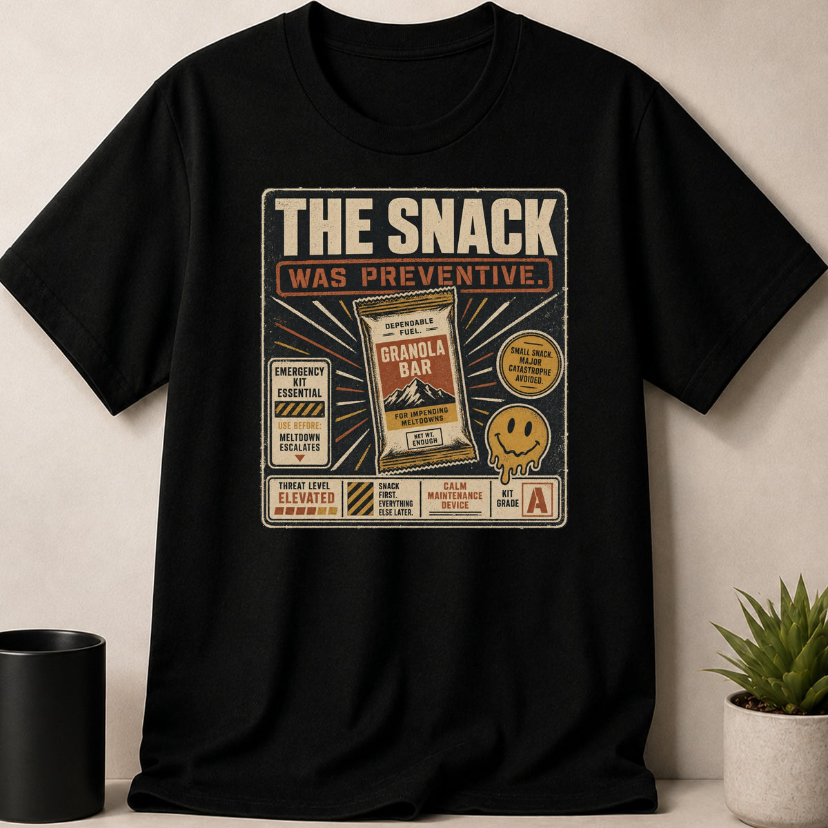 Black t-shirt with "The Snack Was Preventive" design featuring a granola bar and humorous warnings.
