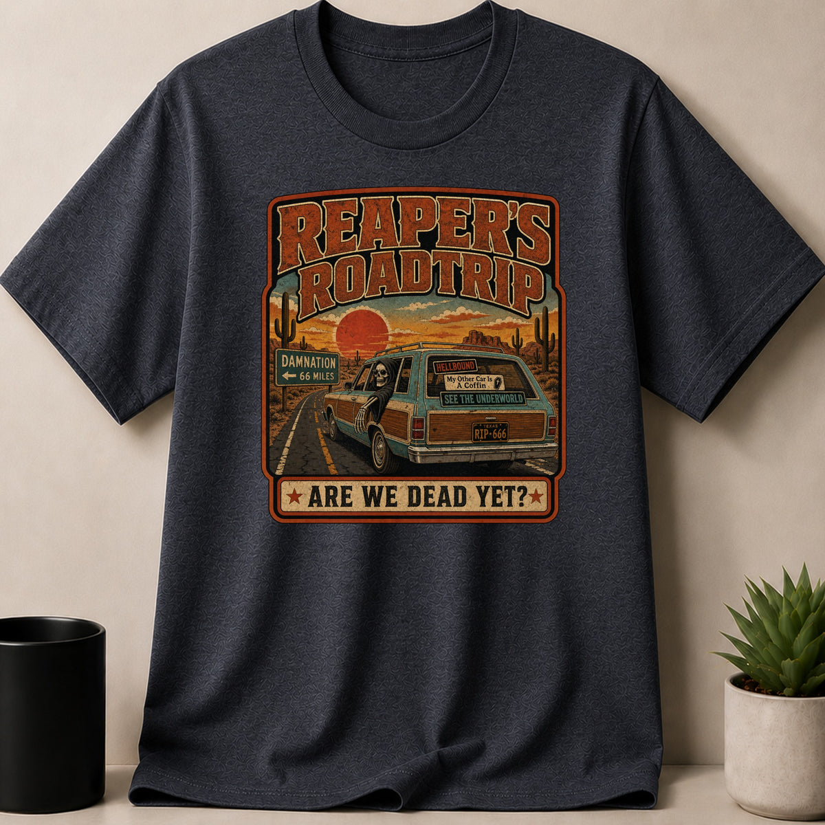 Dark Heather t-shirt — Reaper's Roadtrip graphic with a skeleton driving a station wagon in a desert setting.