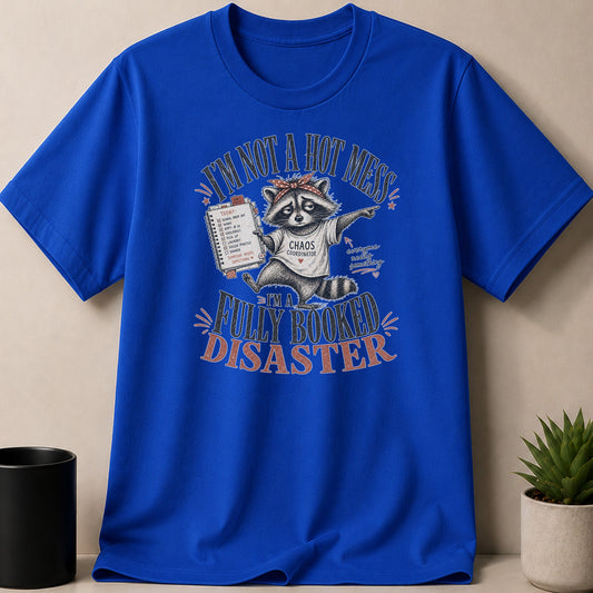 Blue t-shirt with raccoon wearing headband: "I'M NOT A HOT MESS, I'M A FULLY BOOKED DISASTER."