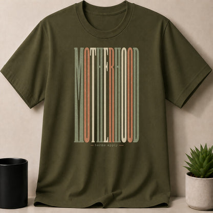 Olive green t-shirt with "MOTHERHOOD - terms apply" in colorful vertical striped lettering.