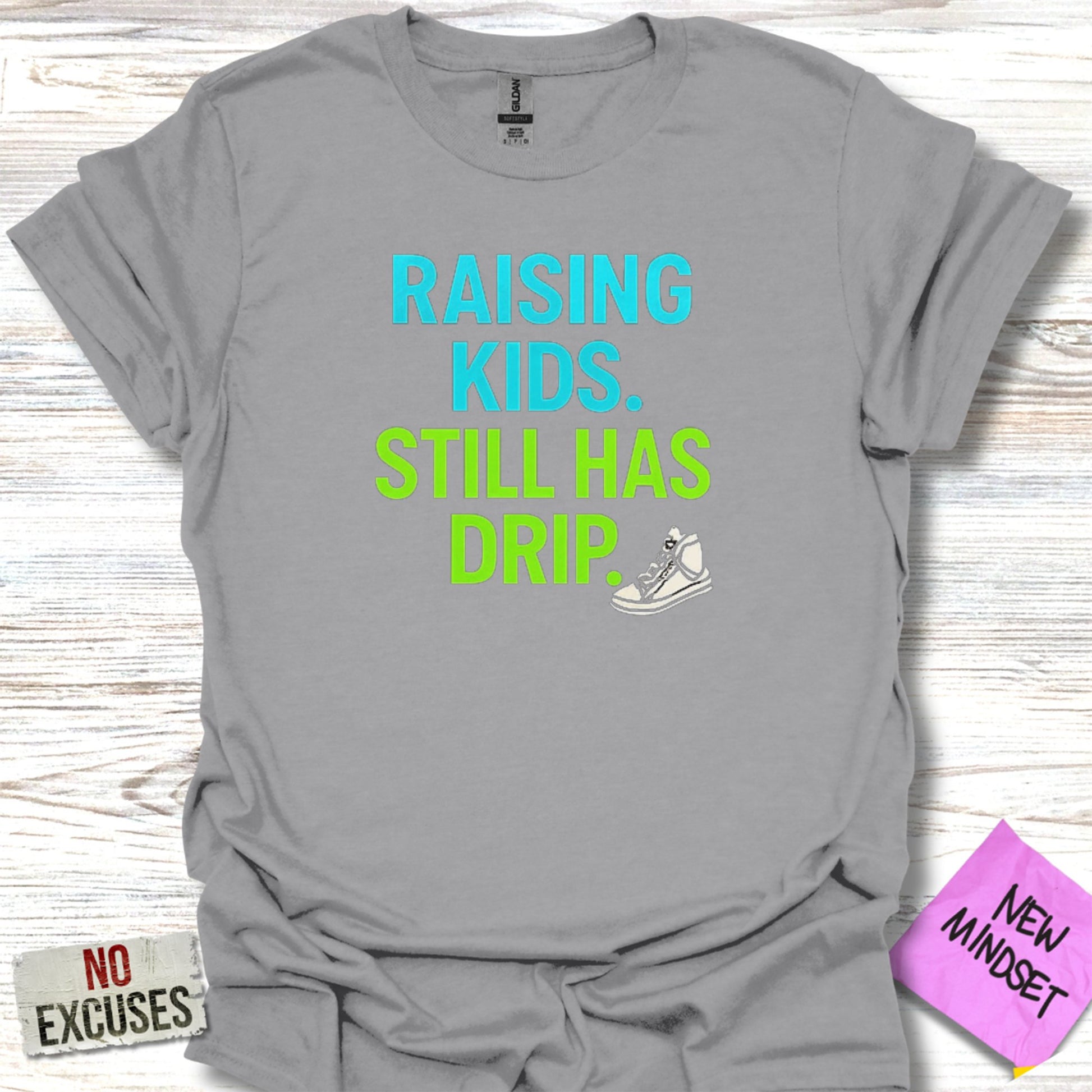Raising Kids Still Has Drip Graphic Tee product