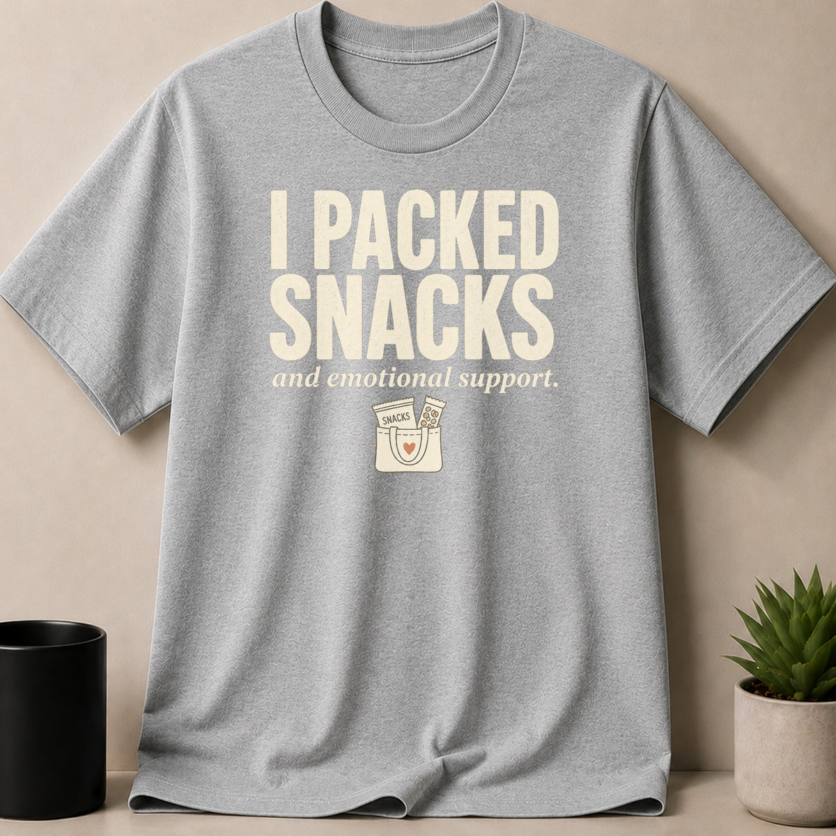 Grey t-shirt with text I PACKED SNACKS and emotional support graphic.
