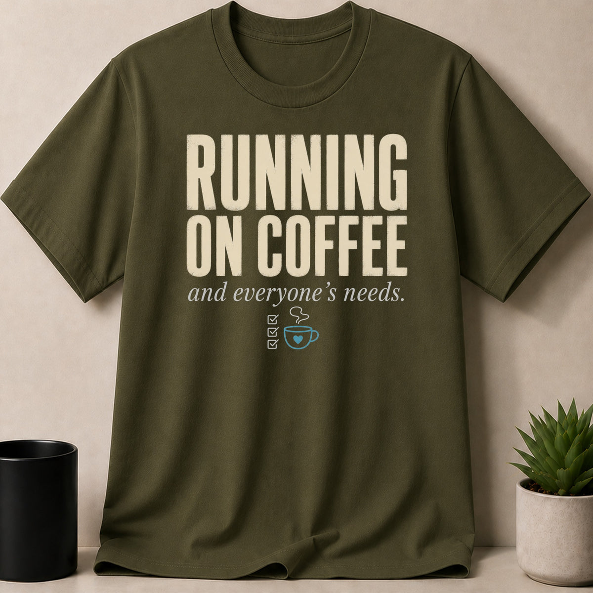 Olive green t-shirt with "RUNNING ON COFFEE and everyone's needs" text.