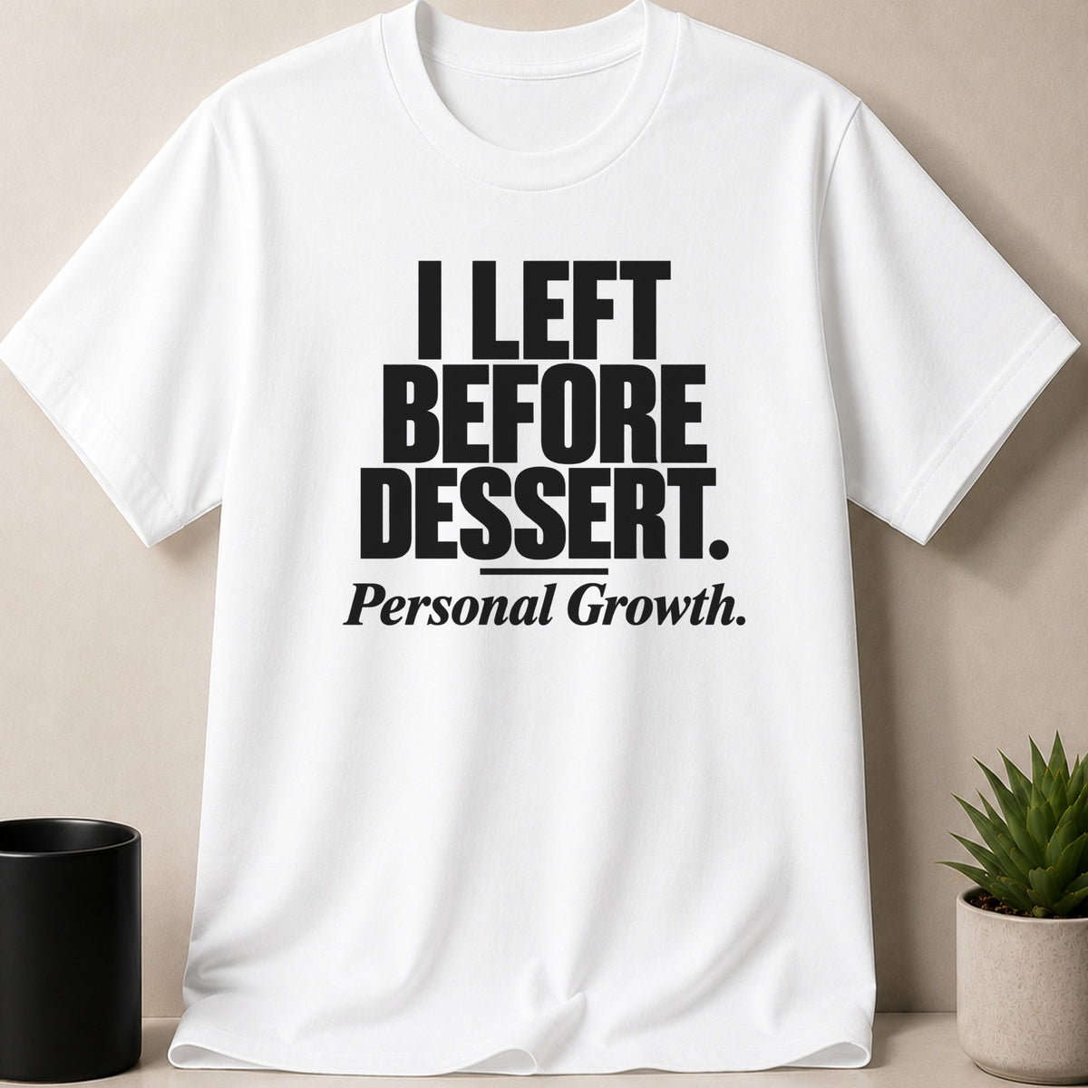 A white t-shirt featuring the black text, I LEFT BEFORE DESSERT, and Personal Growth.