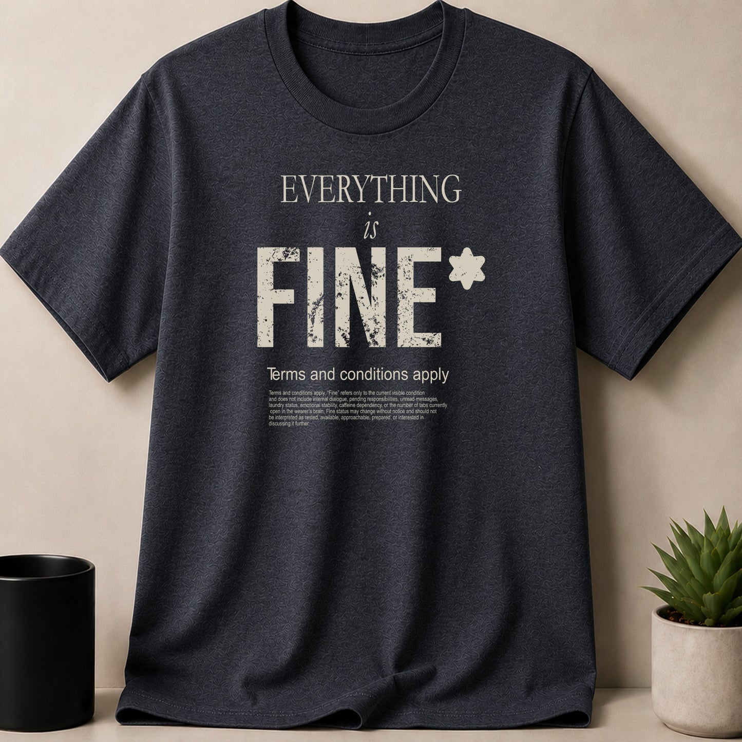 Dark grey t-shirt with "EVERYTHING is FINE*" and disclaimer.