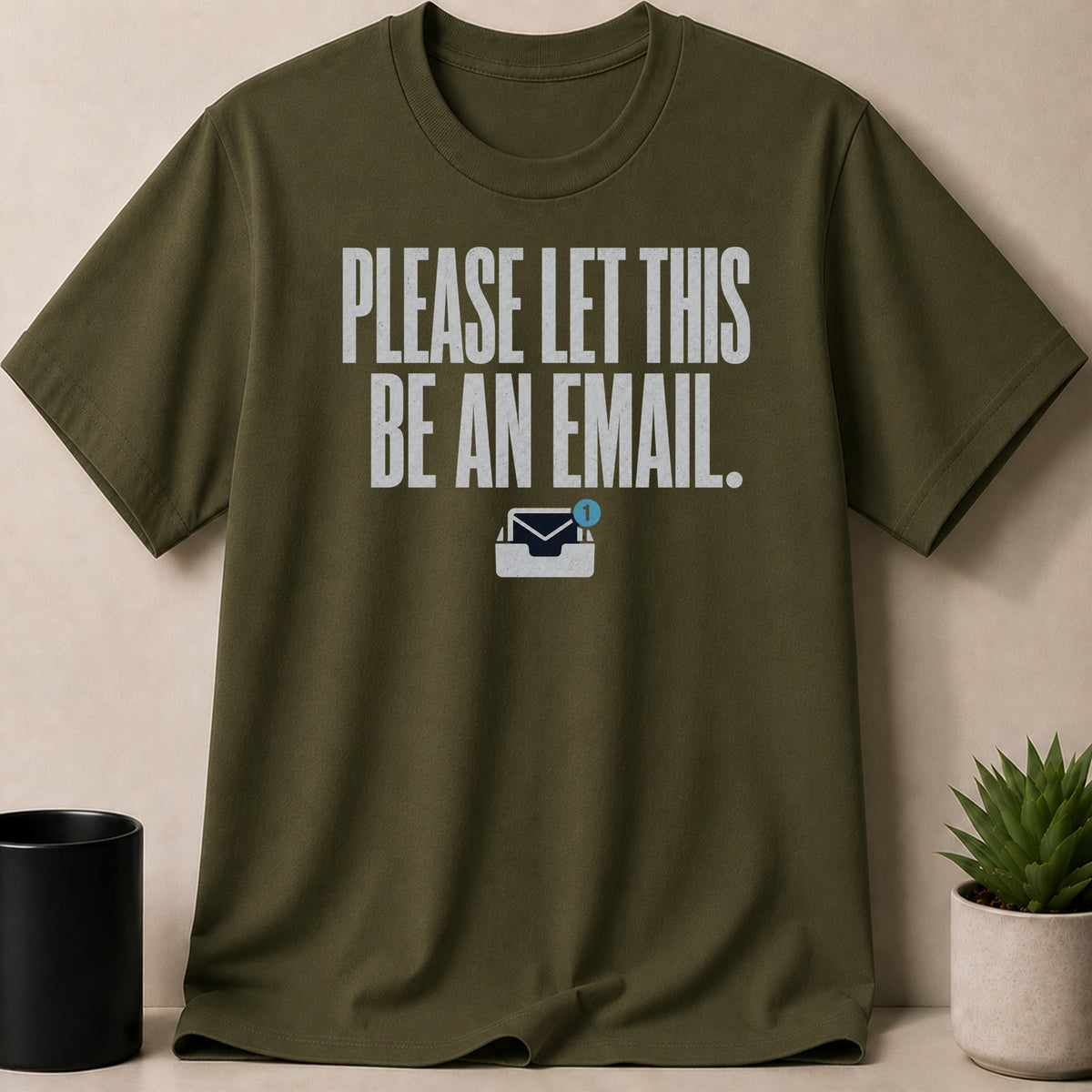 Olive green t-shirt with the text "PLEASE LET THIS BE AN EMAIL."