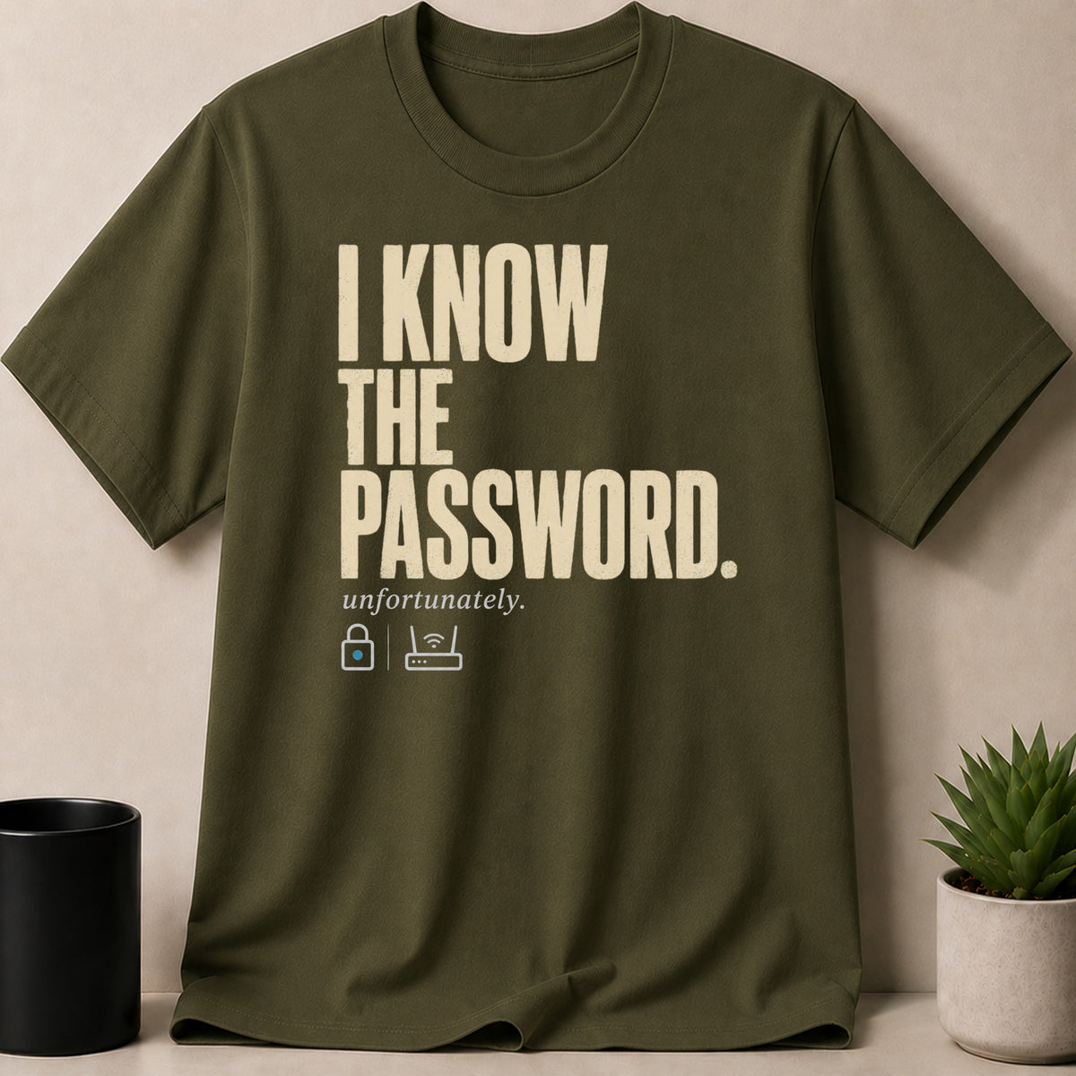 Olive t-shirt with cream text "I KNOW THE PASSWORD. unfortunately." and lock and wifi icons.