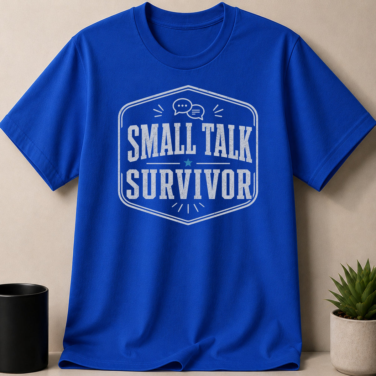 Royal blue t-shirt with "SMALL TALK SURVIVOR" printed in a shield.