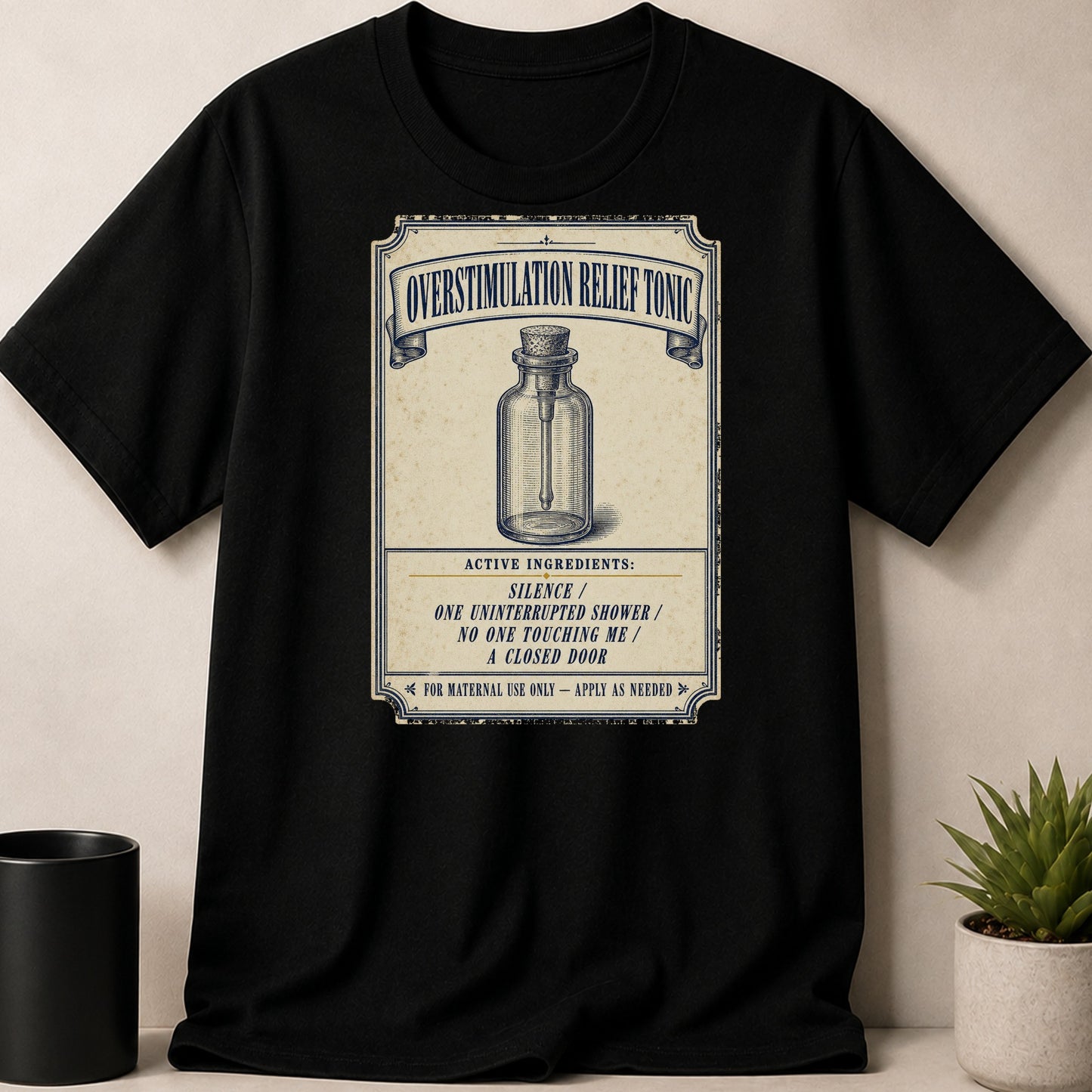 Black t-shirt with "Overstimulation Relief Tonic" label featuring active ingredients.