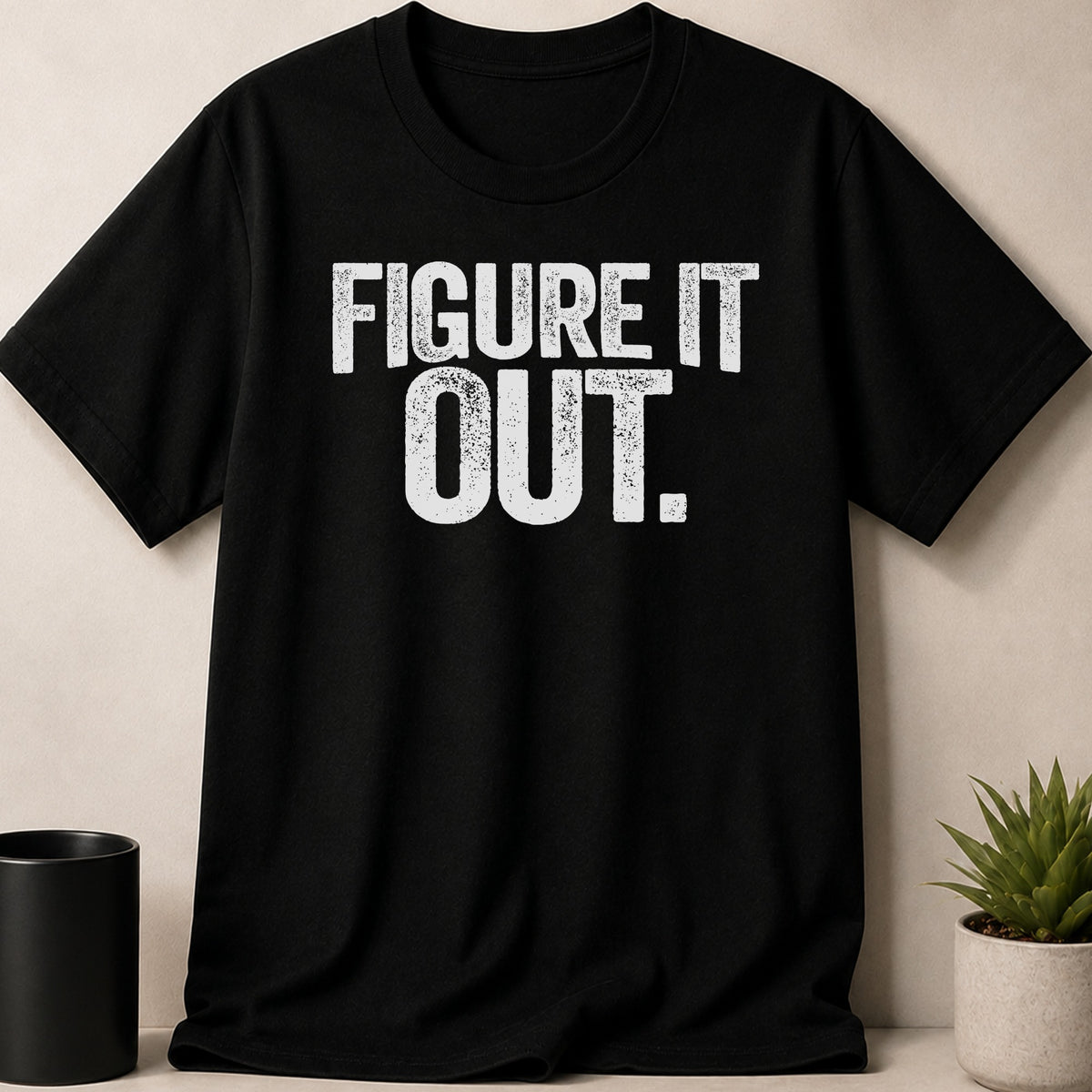 Black t-shirt with white distressed text that reads "FIGURE IT OUT."